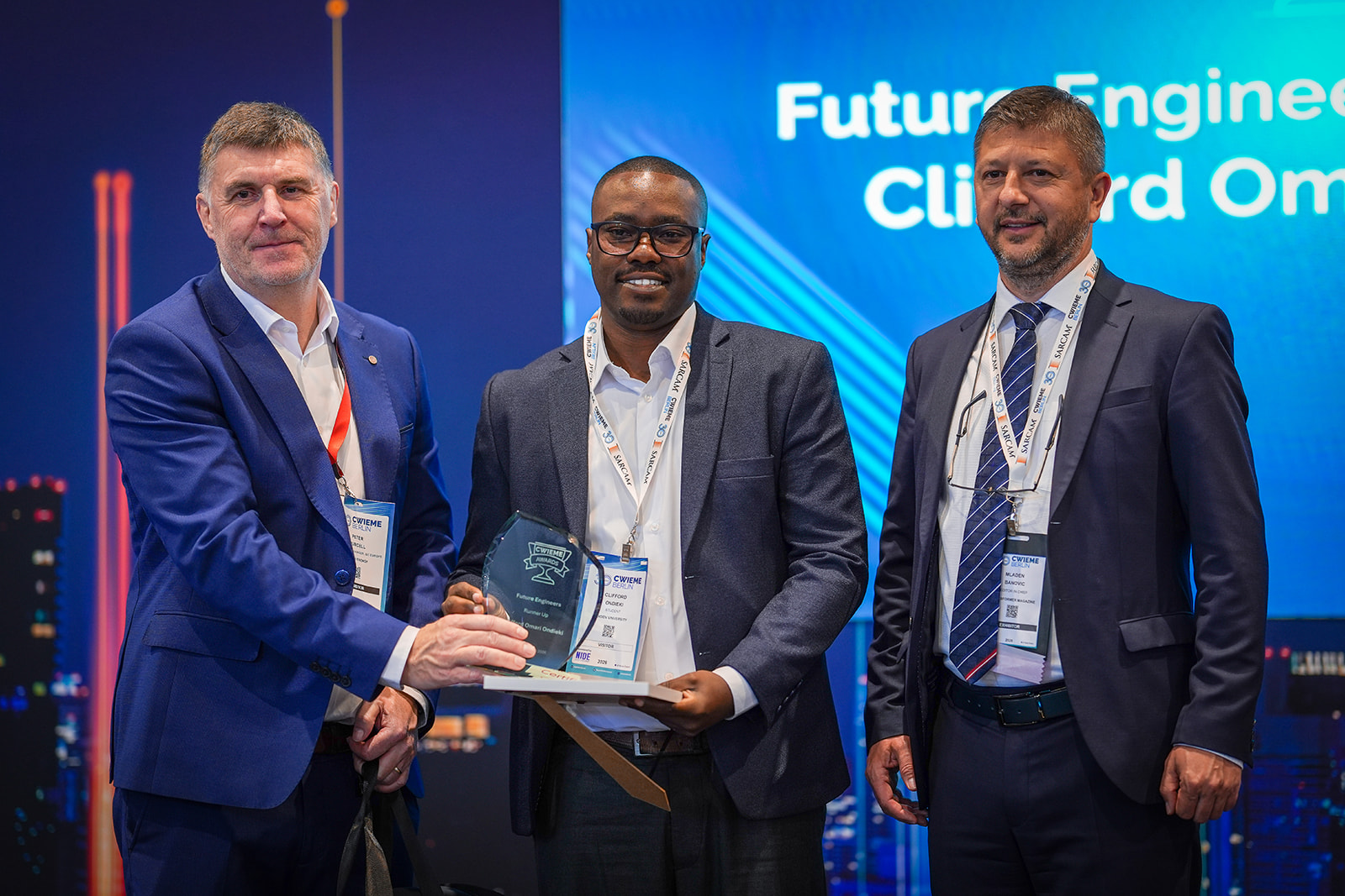 Clifford Ondieki on stage at CWIEME Berlin 2026 with Peter Purcell and Mladen Banovic